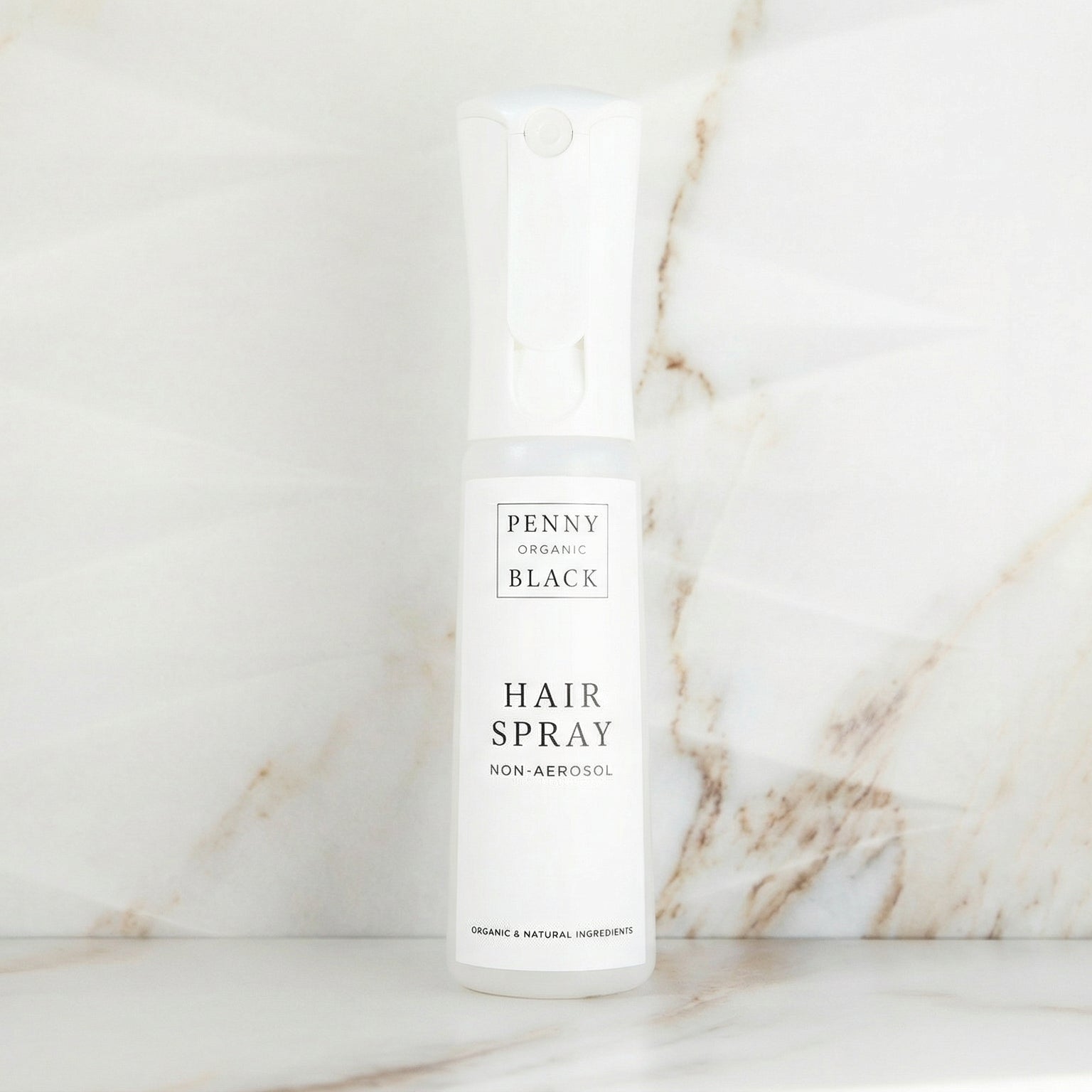 Hair spray bottle on a marble surface